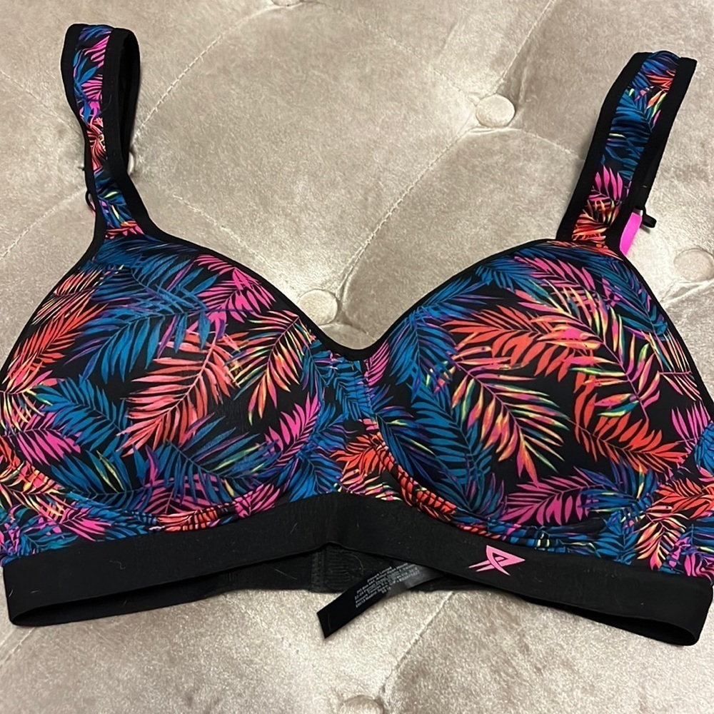 Bright colored molded cup sports bra with adjustable straps, new with tags